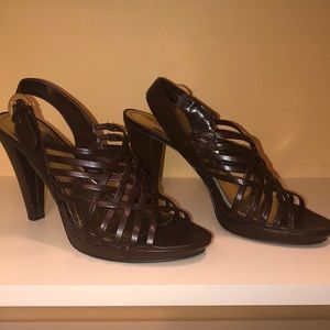 Brown strap heels.